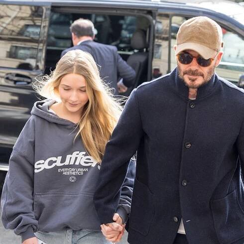 Harper Beckham holds hands with dad David in Paris – and she looks so tall