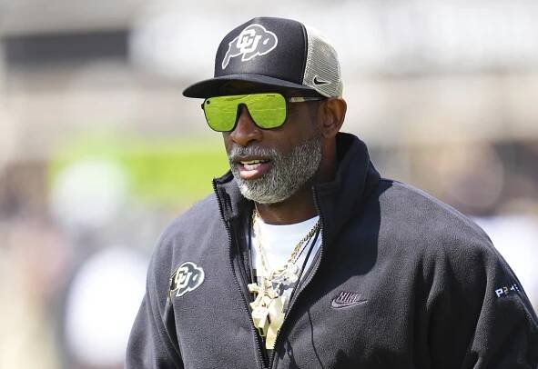 Colorado head coach Deion Sanders warms up before an NCAA college football spring game