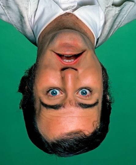 A photo illustration of Andy Kaufman upside-down.