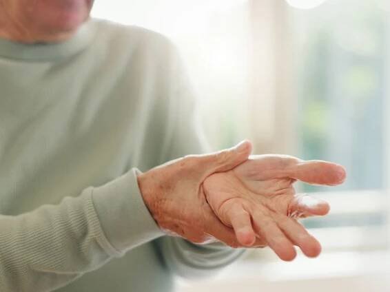 A person notes changes in their hand