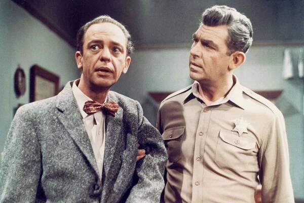 Don Knotts (1924 - 2006) as Deputy Barney Fife and Andy Griffith (right) as Sheriff Andy Taylor in a scene from the television series 'The Andy Griffith Show', circa 1965