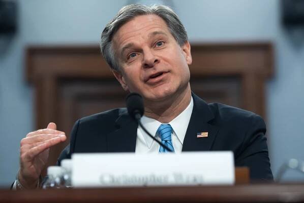 FBI Director Wray distances himself from Barr’s use of ‘spying’ on Trump campaign