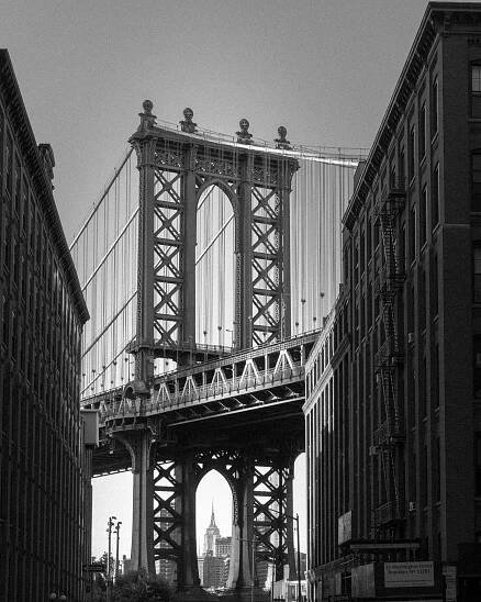 an old photo of the brooklyn bridge in new york city, ny taken from across the street