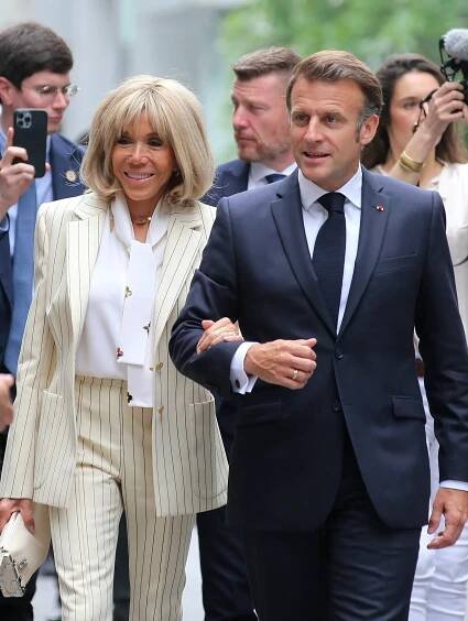 Emmanuel and Brigitte Macron arriving at the Hanoi University of Science and Technology.