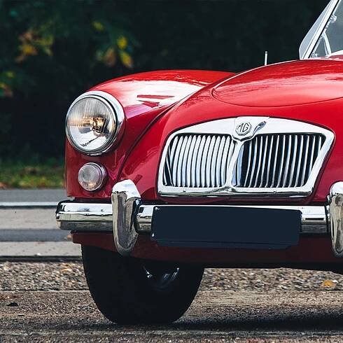 Close-up of a MGA British classic car. Link to a webshop with MGA parts and accessories.