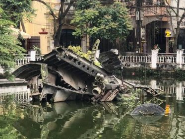 Hữu Tiệp Lake with wrecked B52 Bomber, Hanoi, Vietnam. Photo: Matthew Brannon, 2019