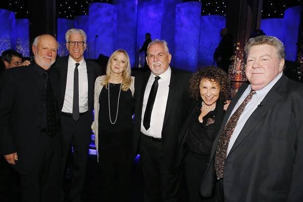 Group photo of James Burrows and several other people at a tribute event.