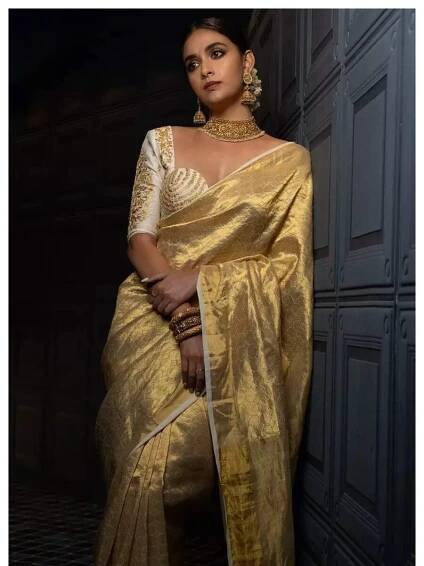 Keerthy Suresh charms in sarees and chic