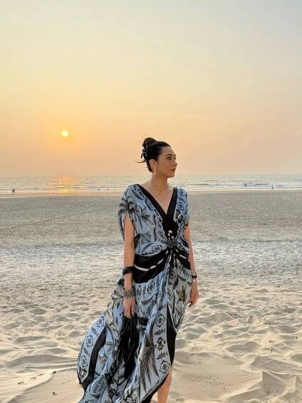 Image may contain Karisma Kapoor Beachwear Clothing Sleeve Adult Person Nature Outdoors and Sky
