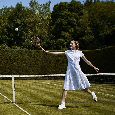 Female model playing tennis