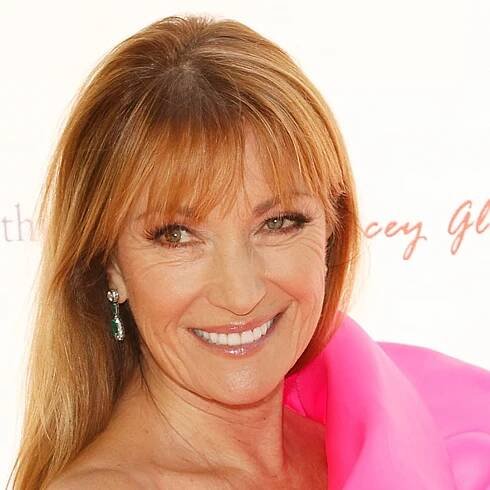 Jane Seymour channels her inner Bond girl with neon pink swimsuit