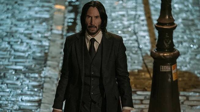 Keanu Reeves' Stunt Double Got Knocked Out By John Wick 4's Epic Stair Fall - SlashFilm