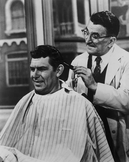 Andy Griffith as Sheriff Andy Taylor and Howard McNear as barber Floyd Lawson in a scene from the television series 'The Andy Griffith Show', circa 1965. 