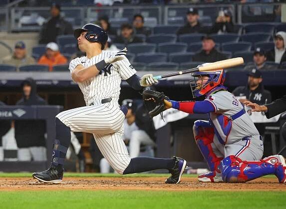 Yankees shortstop Anthony Volpe (11) triples during the second inning 