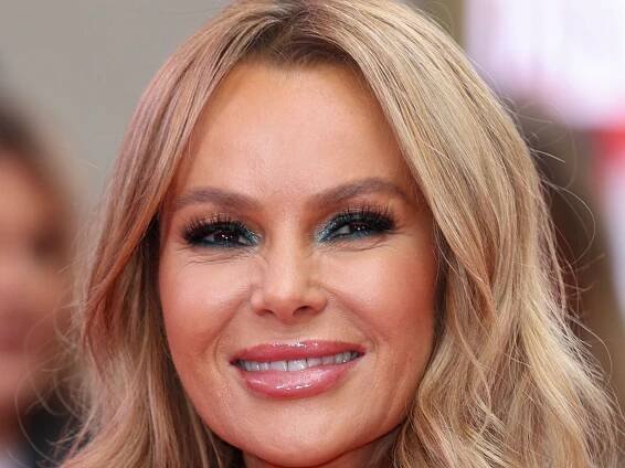 Amanda Holden is a bronzed goddess in daring cut-out mini dress