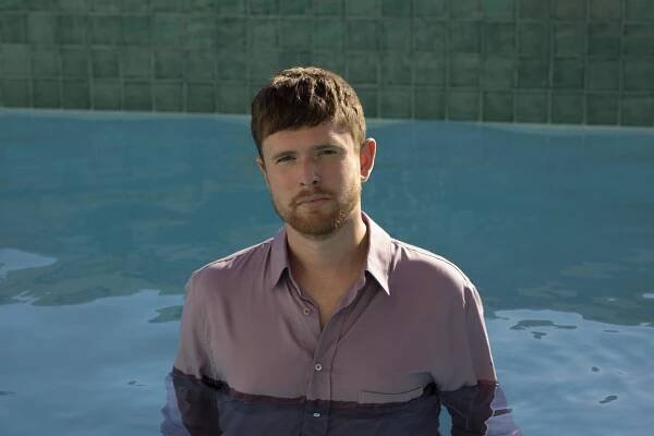 James Blake in a pool of water