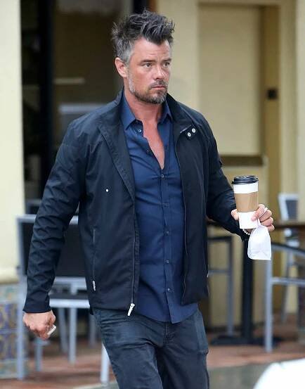 EXCLUSIVE: A sunburned Josh Duhamel cools of in the LA rain.