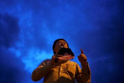 Anon Nampa, one of the leaders of recent anti-government protests, speaks during a demonstration demanding the resignation of Thailand's Prime Minister Prayut Chan-ocha in Chiang Mai, Thailand, on Sunday. |  REUTERS