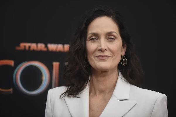 Carrie-Anne Moss in white blazer at a launch event for "The Acolyte" on Thursday, May 23, 2024, in Los Angeles