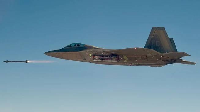 An F-22 fire a missile over clear skies