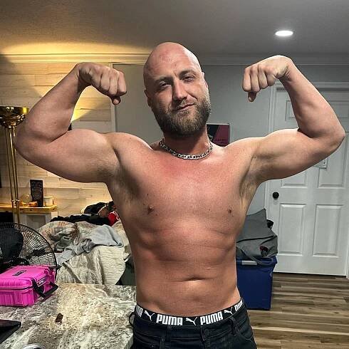Nick Hogan poses for a shirtless selfie, showing off his arm muscles, on his Instagram