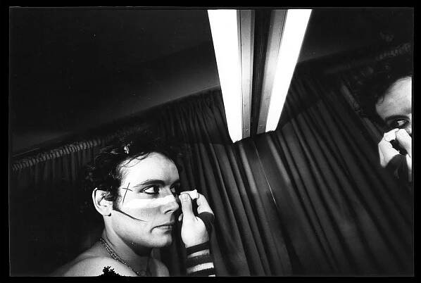 Adam Ant, of post-punk band Adam and the Ants, backstage doing his face make up in a mirror, London, 1980s by Peter Anderson