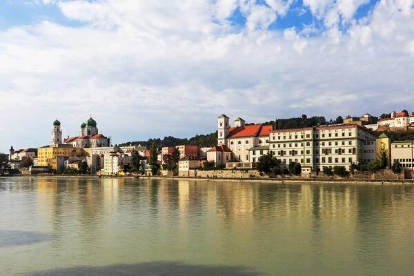 Passau's historic skyline reflected in the Inn River.