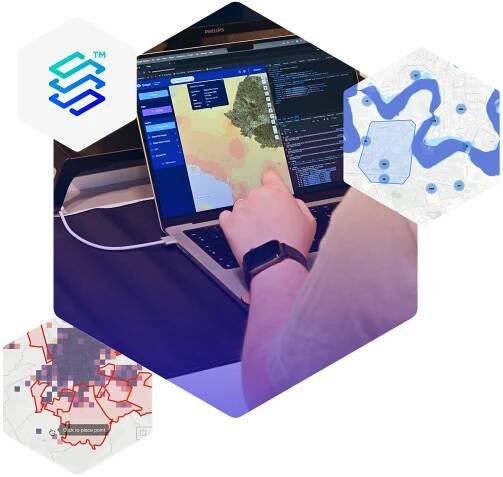 Image of a person using Quarticle’s Graph platform on a laptop, analyzing geospatial data with interactive maps and code interface. Surrounding hexagons display additional map visualizations, including flood zones and risk boundaries, highlighting advanced spatial analytics for insurance and risk intelligence