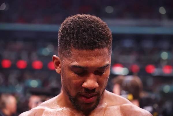 Anthony Joshua reacts to defeat after the IBF World Heavyweight Title fight