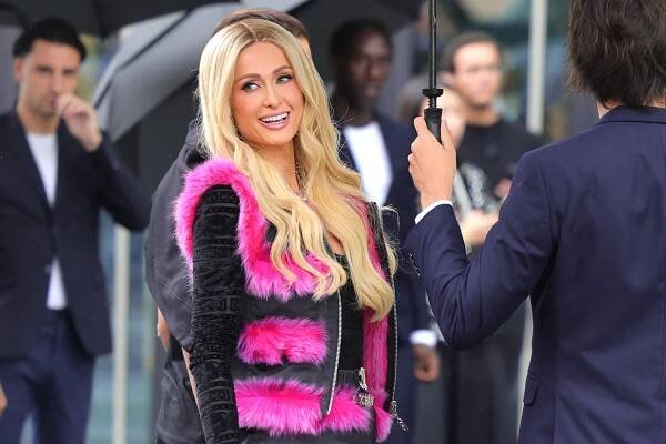 Paris Hilton’s Hot Pink Faux Fur Vest Is Giving Your Favorite Seasonal Lindsay Lohan Character