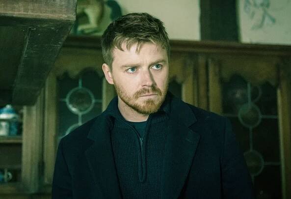 Jack Lowden looking concerned in a scene from "Slow Horses"