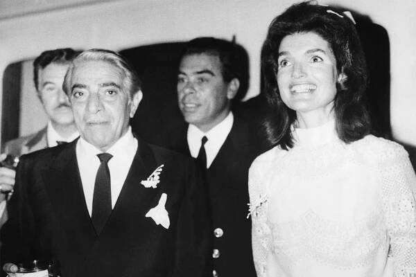 Jackie Kennedy and Aristotle Onassis smile during their Greek honeymoon in 1968