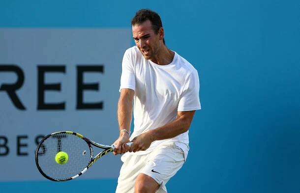a man playing tennis Wallpaper