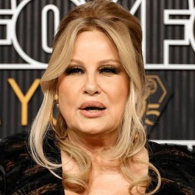Jennifer Coolidge wearing an updo and neutral makeup at the at the Emmy Awards in January 2024