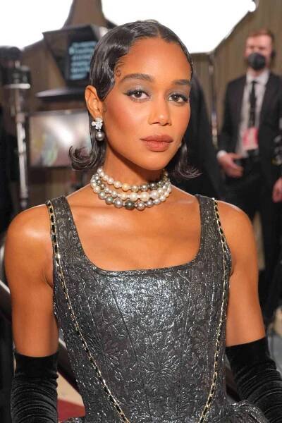 Laura Harrier with finger waves and flipped-up ends.