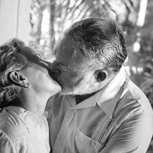 Ernest Hemingway kissing his wife Mary Welsh