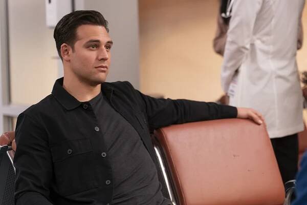 Eddie Diaz sitting on a chair in 'Voices'