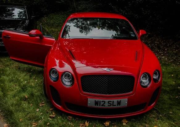 Experience Luxury with the Red Bentley Continental GT Wallpaper