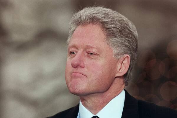 WASHINGTON -- DECEMBER 19: President Bill Clinton reacts to being impeached by the House of Representatives during a news conference outside of the oval office in the White House Rose Garden, Washington, DC, December 19, 1998. (Photo by David Hume Kennerly/Getty Images)