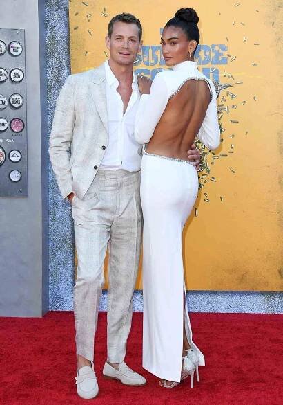 Joel Kinnaman and Kelly Gale attend Warner Bros. Premiere Of "The Suicide Squad" at The Landmark Westwood on August 02, 2021
