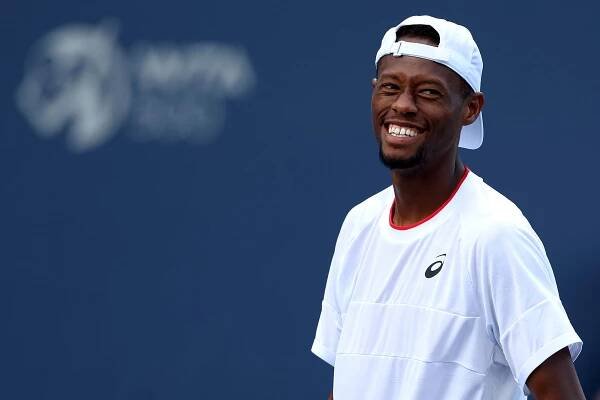 Christopher Eubanks of the United States smiles while playing doubles with partner Sebastian Korda of the United States against Hubert Hurkacz of Poland and Frances Tiafoe of the United States during Day 3 of the Mubadala Citi DC Open at Rock Creek Tennis Center on July 31, 2023 in Washington, DC.