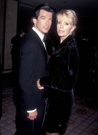 Pierce Brosnan and Cassandra Harris attend the California Fashion Industry Friends of AIDS Project Los Angeles Fifth Annual Fashion Show & Dinner Benefit Salute to Gianni Versace on February 13, 1991 at the Century Plaza Hotel in Century City, California | Source: Getty Images