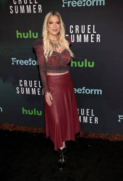 tori at the cruel summer premiere in a long skirt