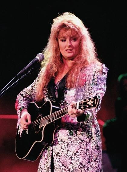 Wynonna Judd performs in a bedjeweled jacket