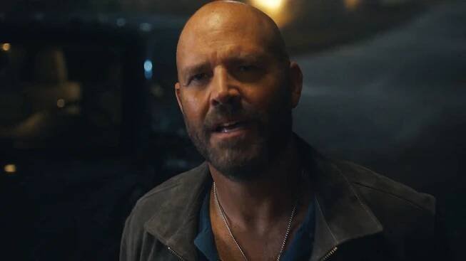 A close up of Keith Smith outside at night in Peacemaker season 2 episode 1