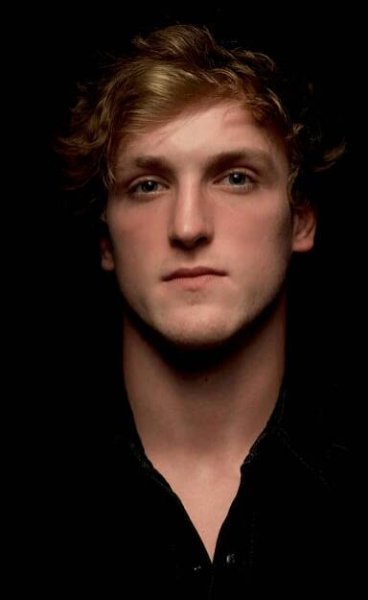 Trendsetter Logan Paul In Bold Red Jacket Wallpaper