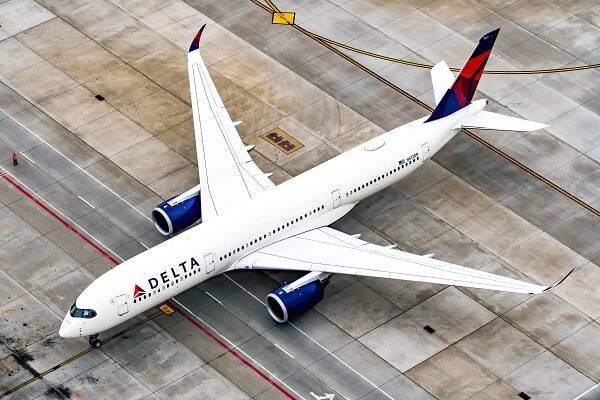 A Delta Air Lines Airbus A350 parked on an airport apron.