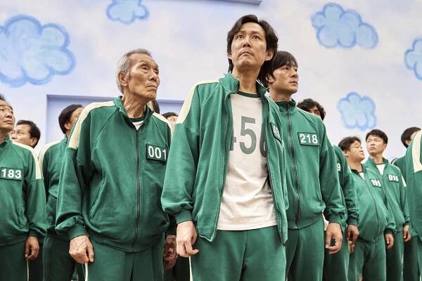 Lee Jung-jae, center, Park Hae-soo, right, and Oh Yeong-soo in a scene from the Korean series "Squid Game." Both Park Hae-Soo and Oh Yeong-Su were nominated for an Emmy Award for best supporting actor in a drama series. Lee Jung-jae was nominated for lead actor in a drama series. (Netflix via AP)