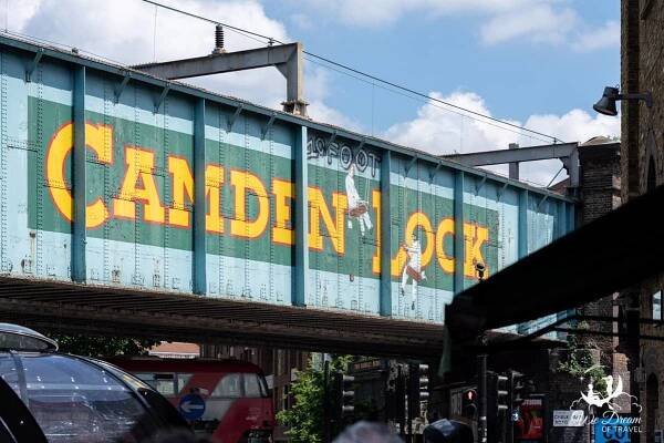 Camden Lock painted on the side of a railway bridge 
