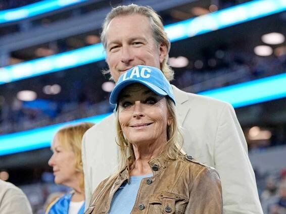 Bo Derek and husband John Corbett attend the football game between the Los Angeles Chargers and the Los Angeles Chargers